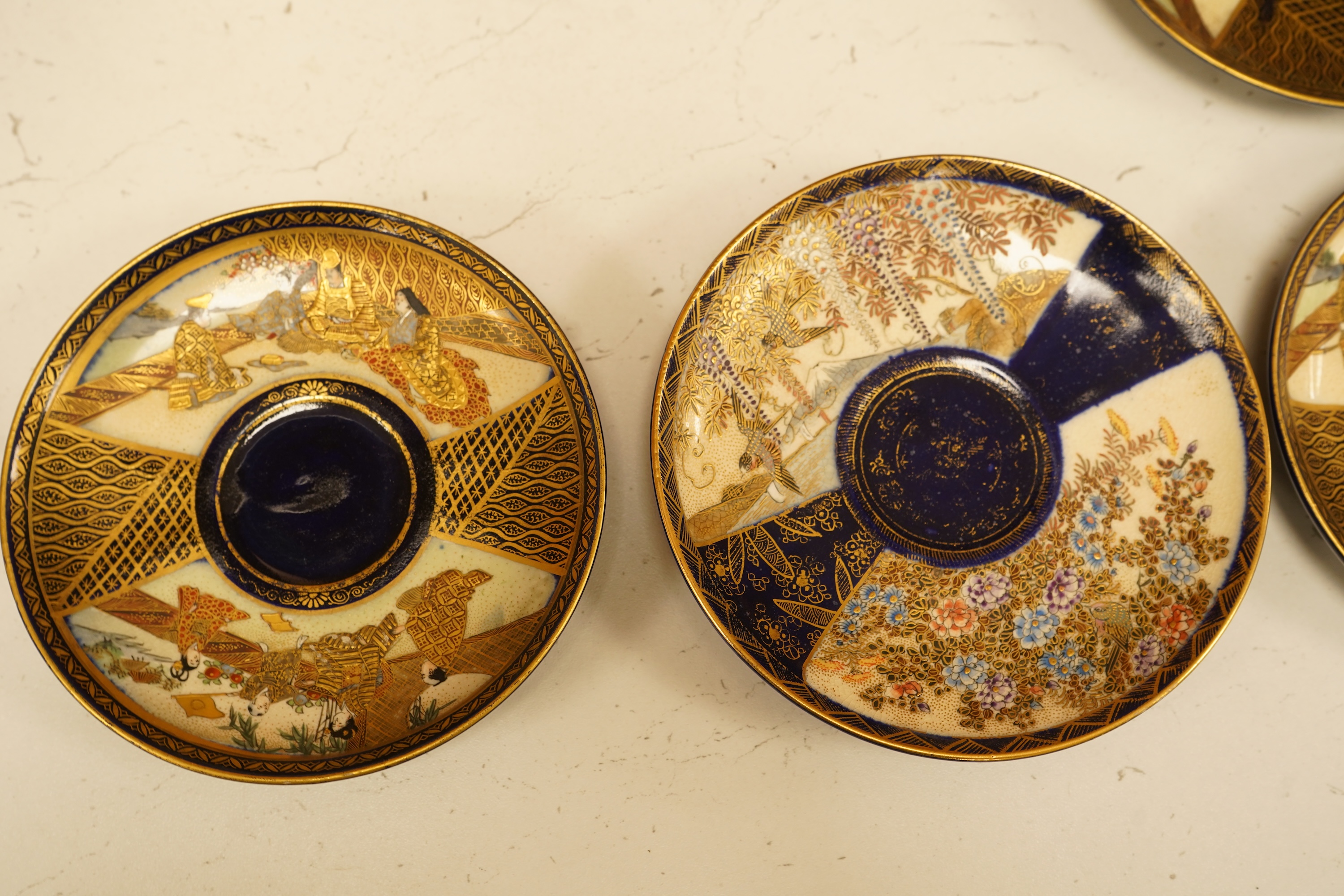 A set of six Japanese Satsuma pottery teacups and saucers, and two further saucers